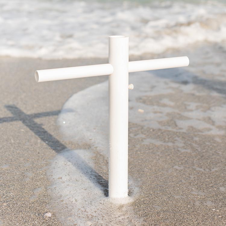A close up of the Suncoast Beach Shade umbrella anchor in shallow water
